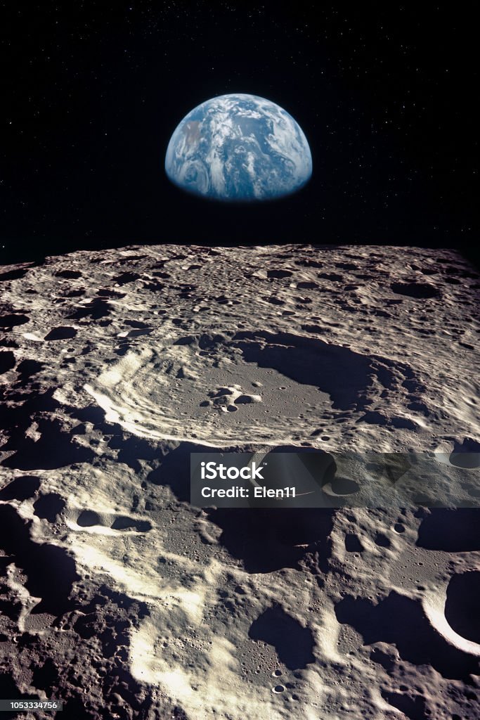 Earth rises above lunar horizon.  Elements of this image furnished by NASA. Moon Surface Stock Photo