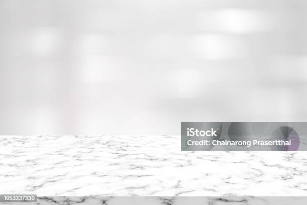 Abstract Blur Clean White Color Interior Contemporary Office Background With Marble Plank Counter Table For Promote And Show Content Or Product On Display Stock Photo - Download Image Now