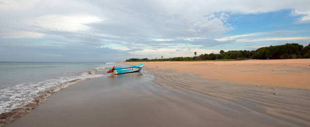 istock Beached boat on Nilaveli beach in Trincomalee Sri Lanka Asia 1053337454