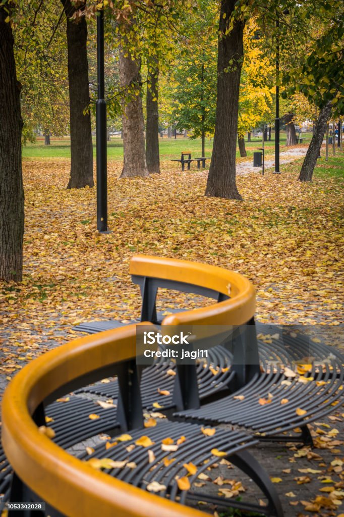 Park in fall Park benches of Slovak park in Koice in the fall Autumn Stock Photo