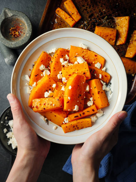 roasted butternut squash with feta cheese - butternut squash roasted squash cooked imagens e fotografias de stock