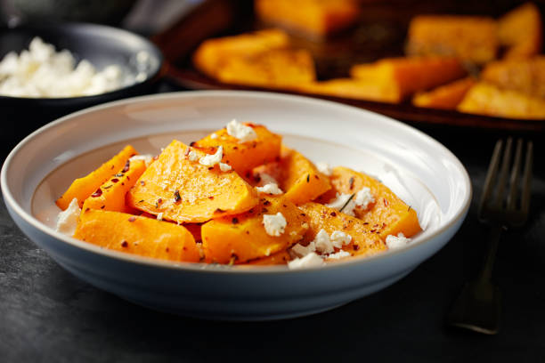 roasted butternut squash with feta cheese - butternut squash roasted squash cooked imagens e fotografias de stock