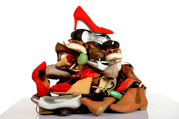 istock Used woman shoes on white background 1053349308