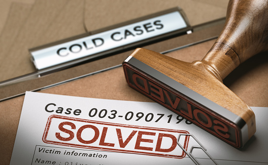 3D illustration of a cold case file with a rubber stamp and the word solved. concept of successful police investigations