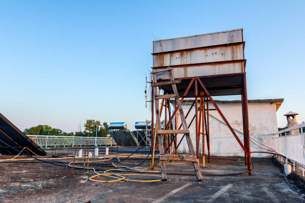 istock Rusty old metal tank for water heating, green energy 1053366402