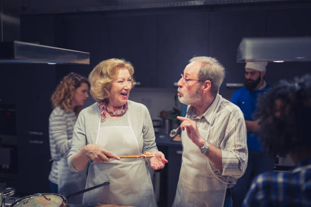 istock Senior couple enjoy cooking class 1053372466