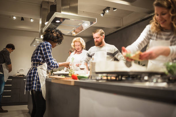 istock Cooking class participants having fun, enjoying their time 1053372576