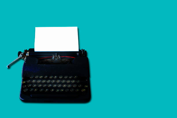 istock Vintage typewriter on green backgrounds with clipping path 1053373286