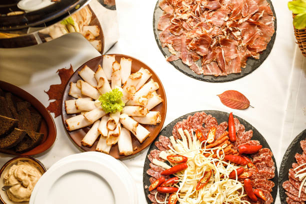 istock Beautifully decorated catering banquet table with different food snacks. 1053373306