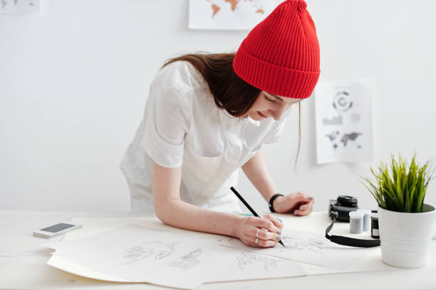 istock Woman drawing sketches 1053382834