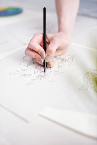 istock Woman drawing sketches 1053383042