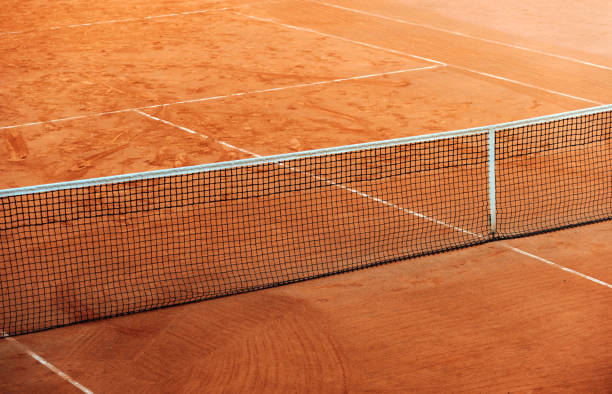 High angle view of empty, red clay, tennis court High angle view of empty, red clay, tennis court good condition stock pictures, royalty-free photos & images