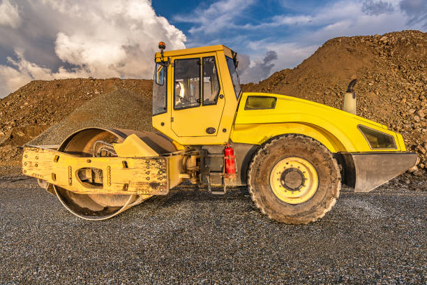 istock Steamroller performing road paving works 1053384752