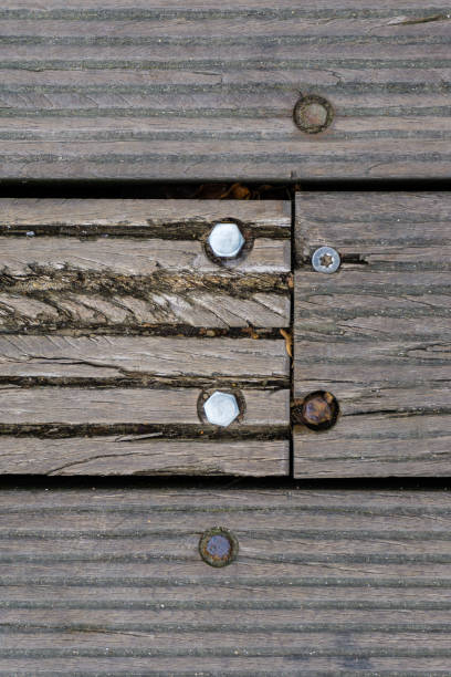 istock wooden floor with screws 1053387384