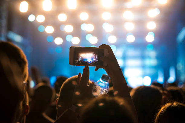 istock People at music festival. 1053387938