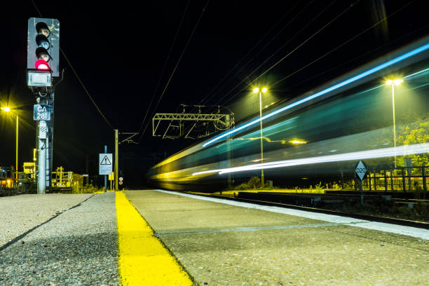 istock Light trails taken from a passing train in blurred motion 1053387982
