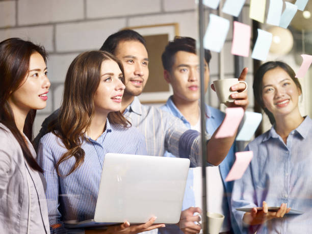 istock young asian corporate executive working together in office 1053389944