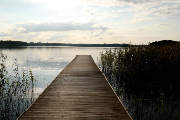 istock Wooden pier with sunset 1053392544