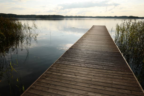istock Wooden pier with sunset 1053392552