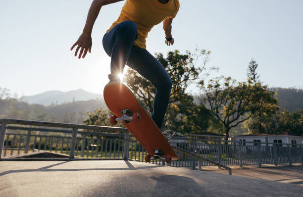 istock Skateboarder doing ollie at skatepark ramp 1053394994