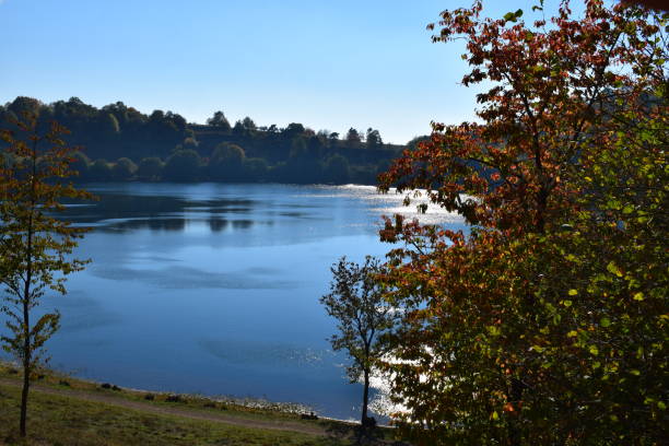 istock low sun on Weinfelder Maar volcano lake 1053395684