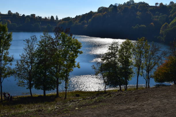istock low sun on Weinfelder Maar volcano lake 1053398200