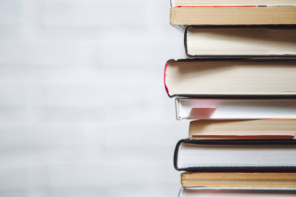 istock Stack of hardback books on wooden table. Back to school. Copy space for text 1053400614