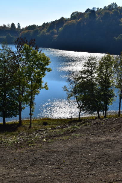 istock low sun on Weinfelder Maar volcano lake 1053401256
