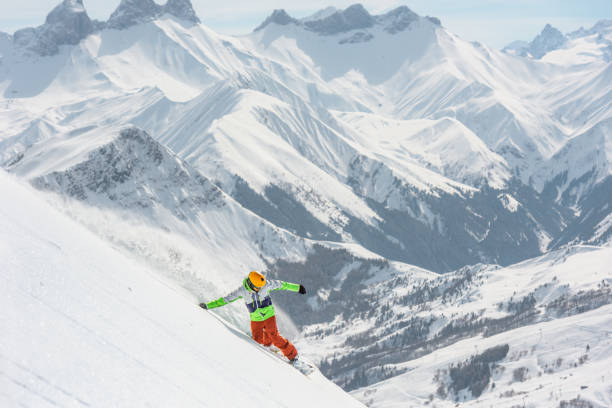 istock Snowboarder in Action in Fresh Powder Snow 1053409354