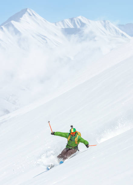 istock Man free rider skiing  on powder snow 1053409456