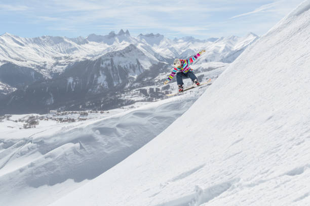 istock Extreme Female snowboarder jumping 1053409484