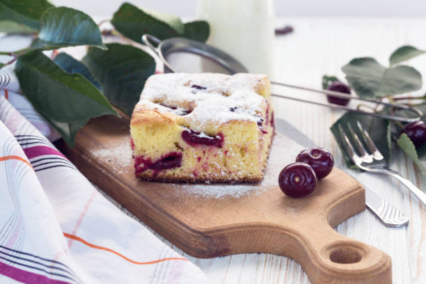 istock Cherry pie, milk and cherries on the table 1053412386