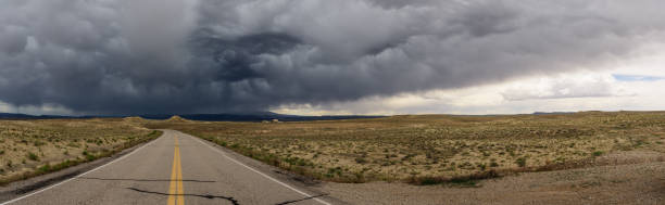 istock Utah road and incoming storm 1053416032