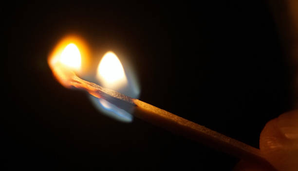 istock Flame of the match burning in fingers 1053419746