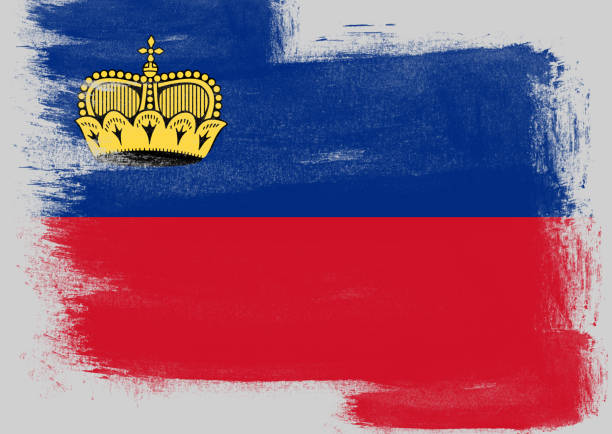 Flag of Liechtenstein painted with brush on solid background,