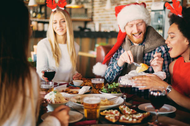 istock Friends having dinner at home at Christmas eve. 1053426810