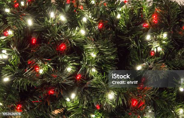 Multi Colored Illuminated Lights On Christmas Tree Stock Photo - Download Image Now - Christmas Tree, Christmas Lights, Close-up