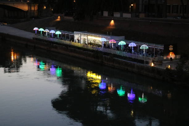 istock River Tiber at night in Rome, Italy 1053429032