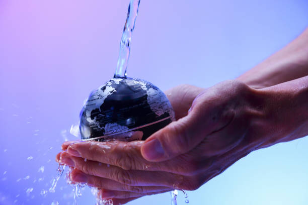 istock Water pouring on planet earth 1053429438