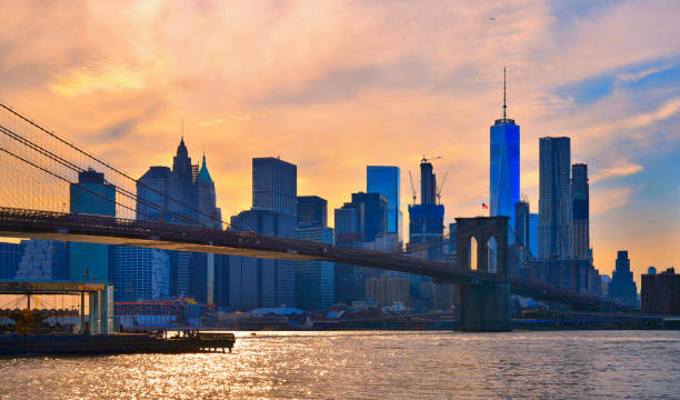 istock sunset on manhattan modern architecture skyline with brooklyn bridge in Manhattan New York city 1053440194