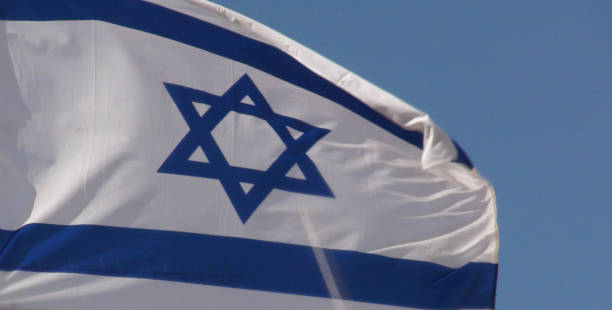istock Israeli Flag Against Blue View In Jerusalem 1053440742