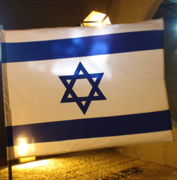 istock Looking At Israel National Flag In Jerusalem 1053441086