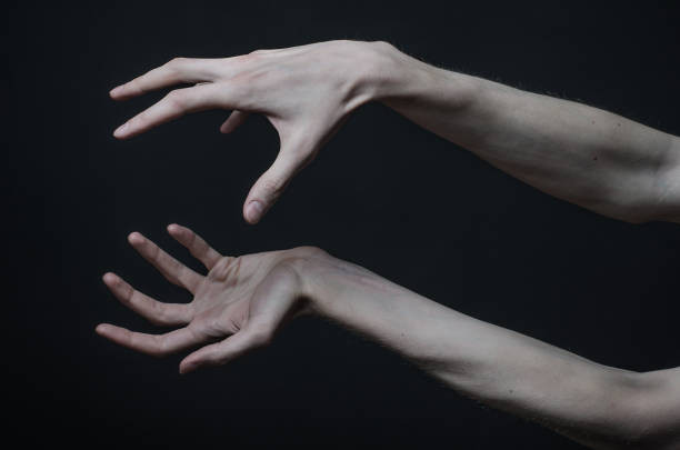 istock Gothic horrible Halloween theme: thin hands of death 1053441272
