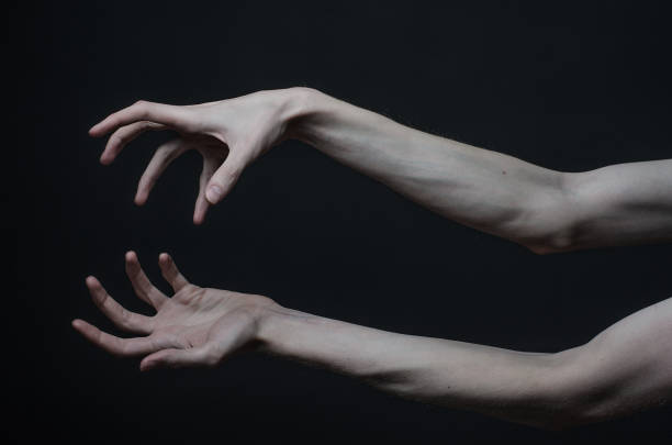 istock Gothic horrible Halloween theme: thin hands of death 1053444228