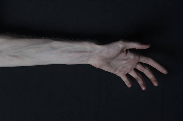 istock Gothic horrible Halloween theme: thin hands of death 1053444472