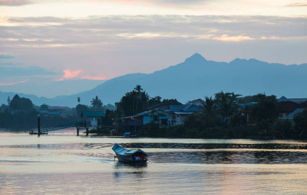 istock boat floating on a river in Kuching, Borneo 1053444506