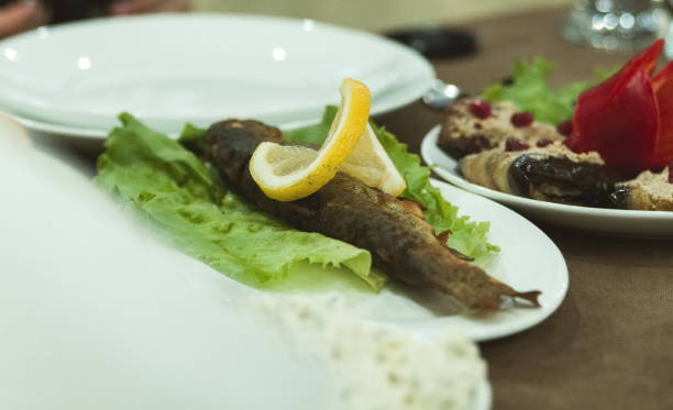istock Close-Up Of Fried Fish And Vegetables In Plate On Table 1053449710