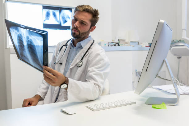 istock Attractive doctor examining an x-ray 1053457822