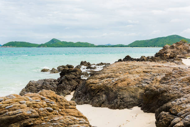 istock White sand beach with blue sea on Koh Samaesarn. 1053465340