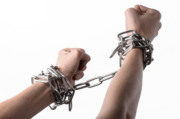 istock Social theme: hands tied a metal chain on a white background 1053465476